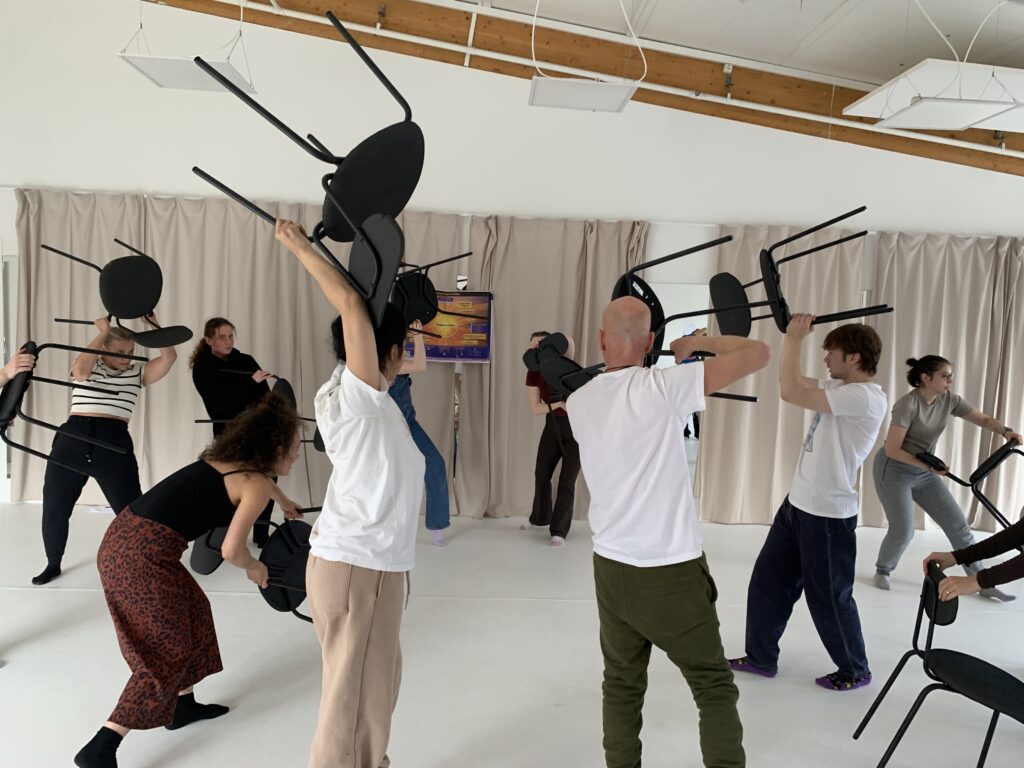 Participants work with manuevering chairs to experience a feeling of ease.