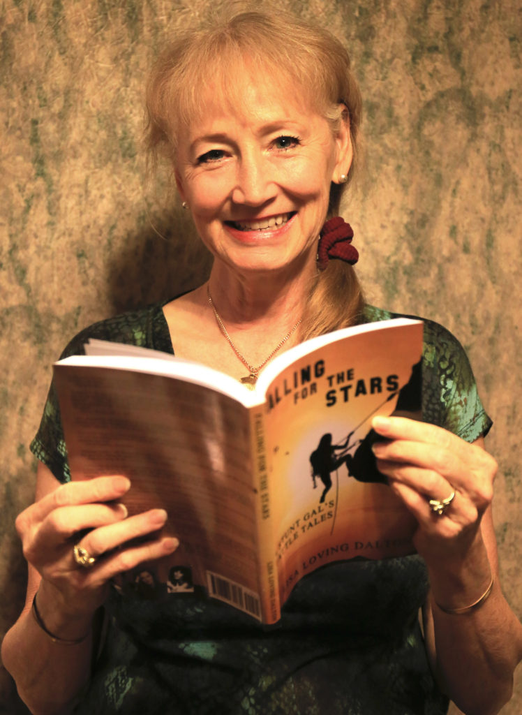 Lisa Dalton opens her first copy of her first book.
